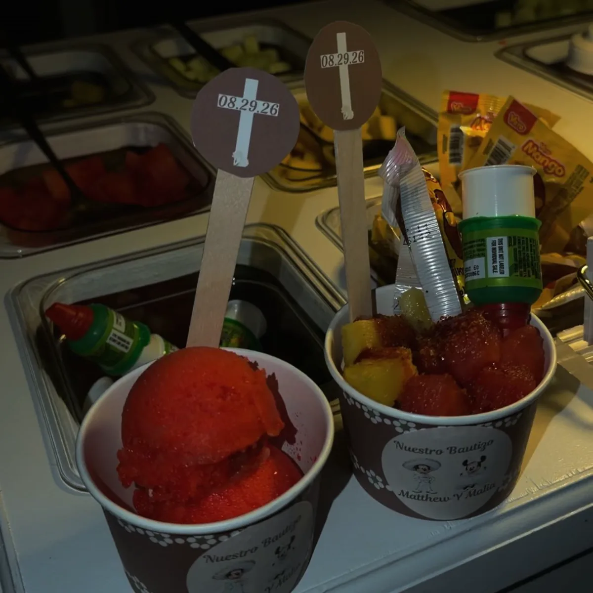 Personalized Italian ice and fruit cups prepared for a baptism